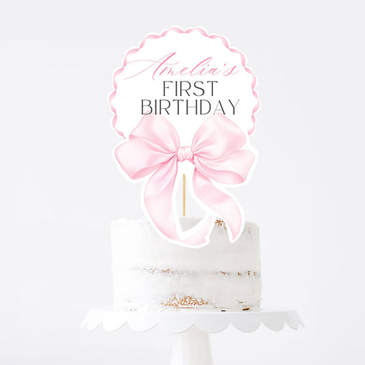 Elegant pink bow topper for a girl’s first birthday. Editable Canva template, printable and perfect for cake or centerpiece decor.